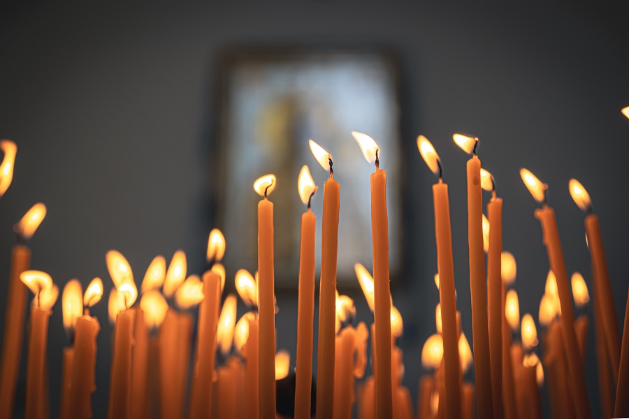 Close-up, candles in the temple on a blurred background.